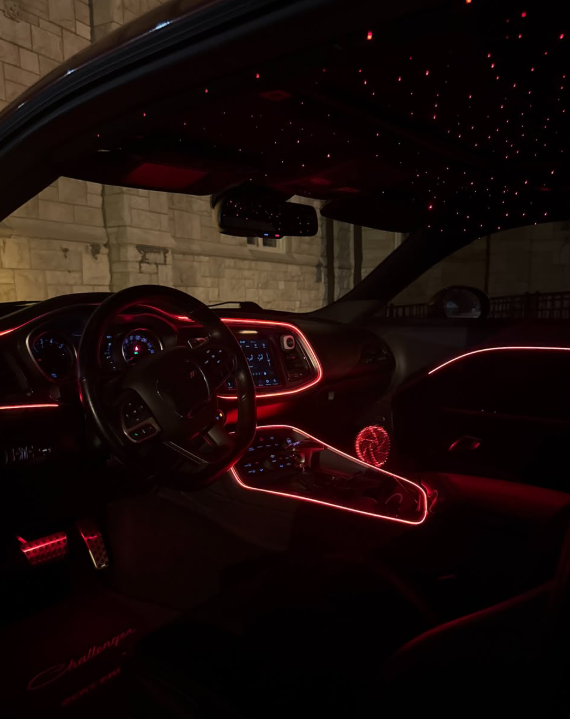 Red ambient interior lighting in car dashboard
