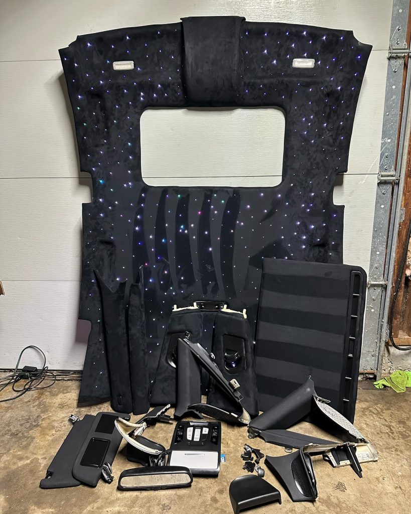 Disassembled car door panel showing interior mechanics