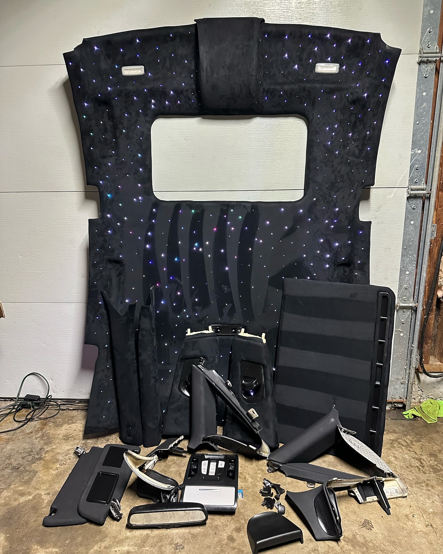 Disassembled car door panel showing interior mechanics